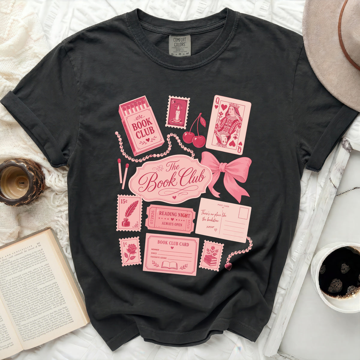 Book Club graphic tee with playing cards, stamps, and a postcard.