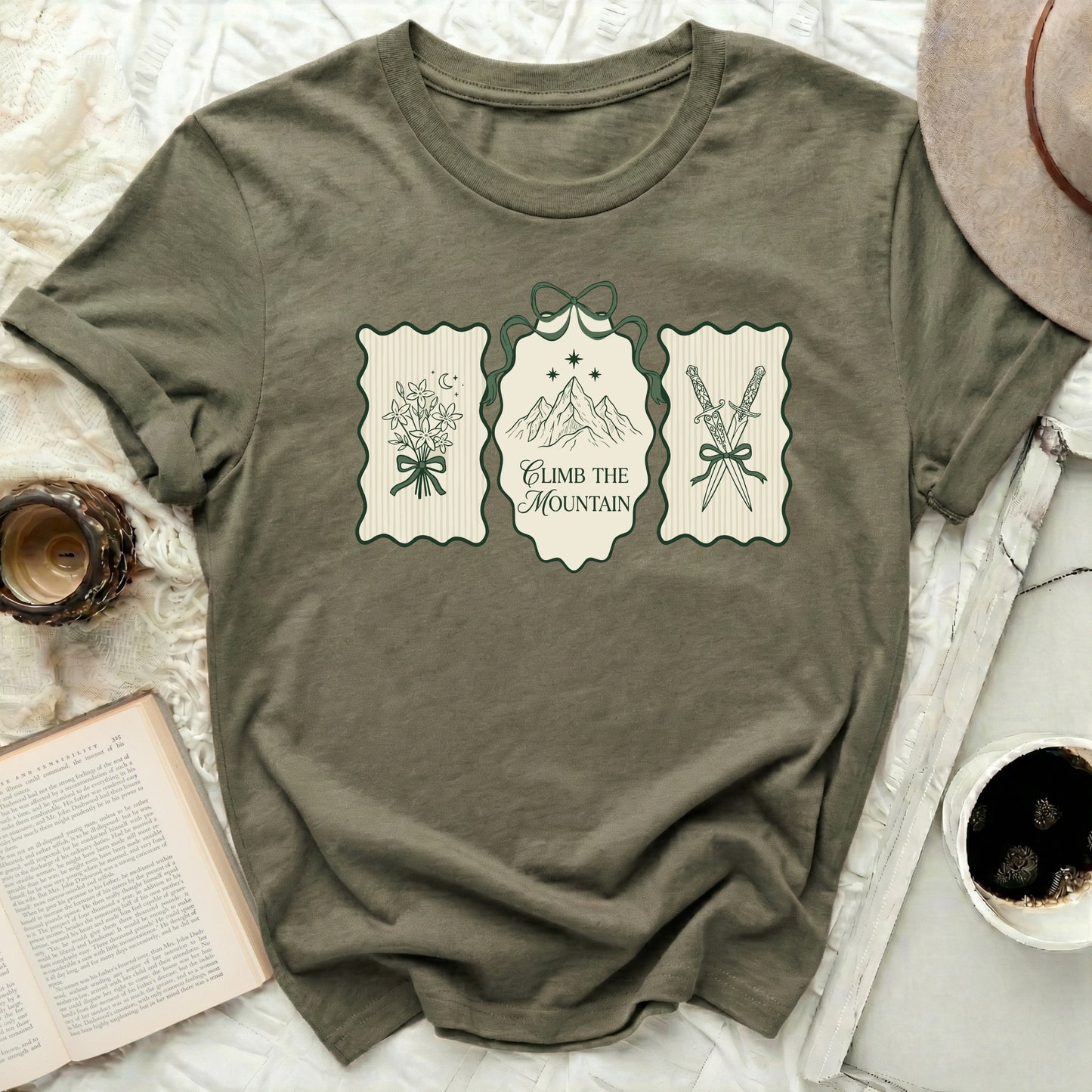 Climb The Mountain Swords Flowers Stars Moon Olive Green product type
Olive Green, Mountain Graphic, Swords Print, Floral Design, Stars Moon Art, Climb Mountain, Adventure Graphic, Fantasy Art, Nature Inspired, Unique Graphic, Outdoor Design, Green Tee, Graphic Apparel, Aesthetic Print, Forest Green, Mystical Design, Dagger Graphic, Flower Bouquet, Celestial Elements, Inspirational Text
