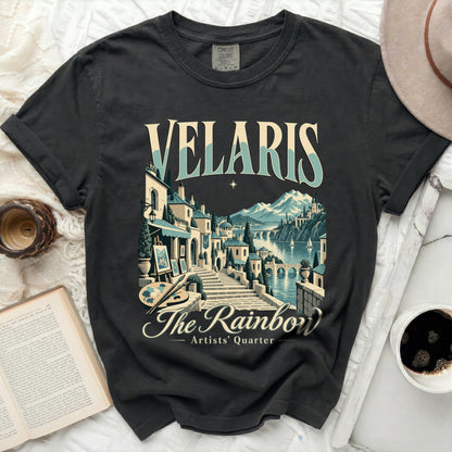 Dark grey t-shirt with "Velaris The Rainbow Artists' Quarter" graphic.