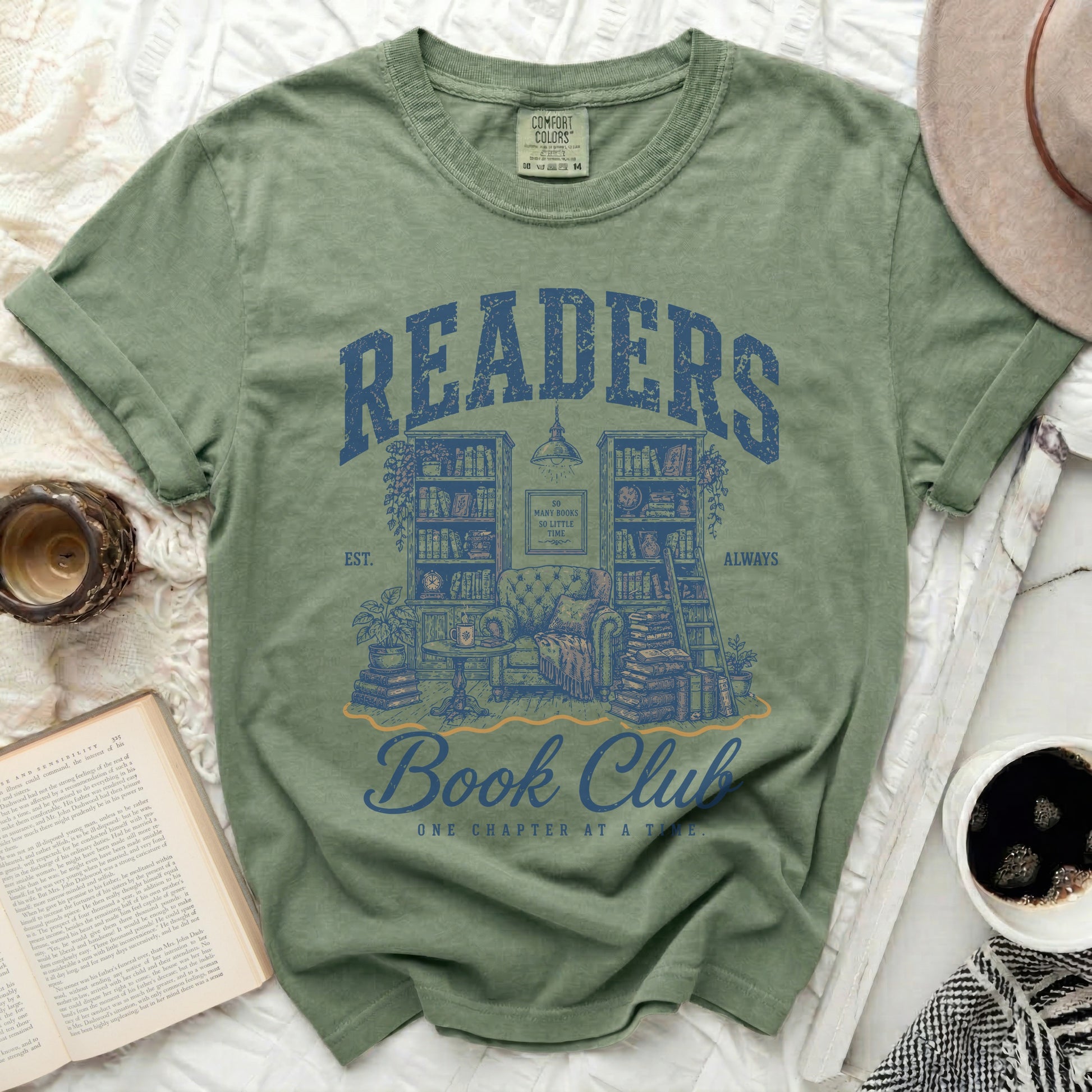 Green t-shirt with "Readers Book Club" graphic featuring books and furniture.