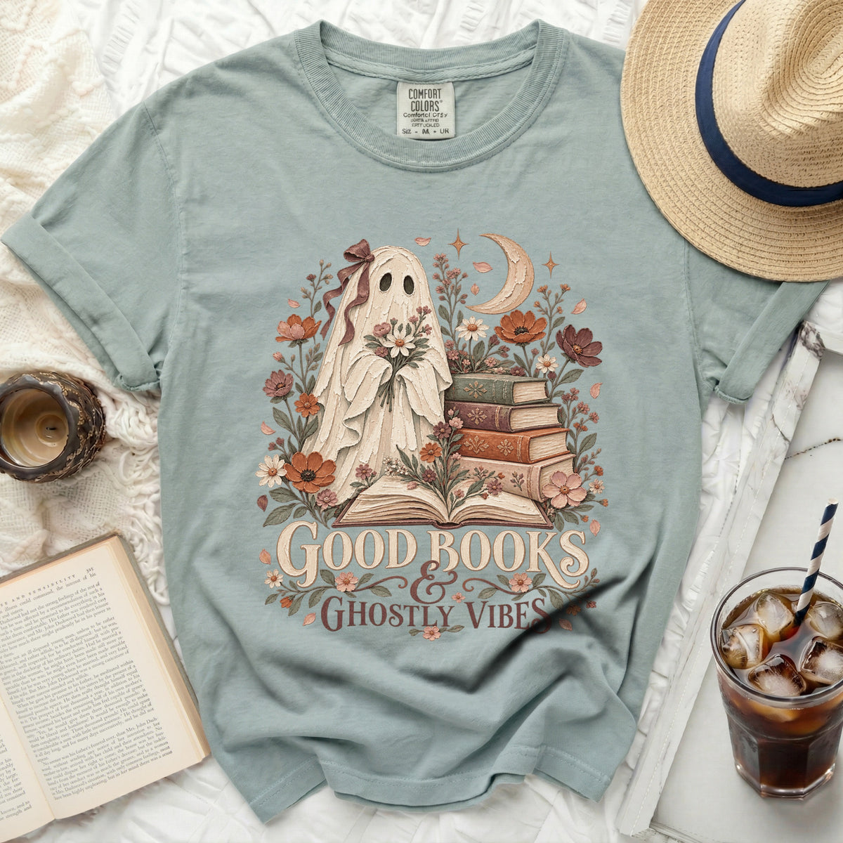 Ghost holding flowers with books and moon, "Good Books & Ghostly Vibes".