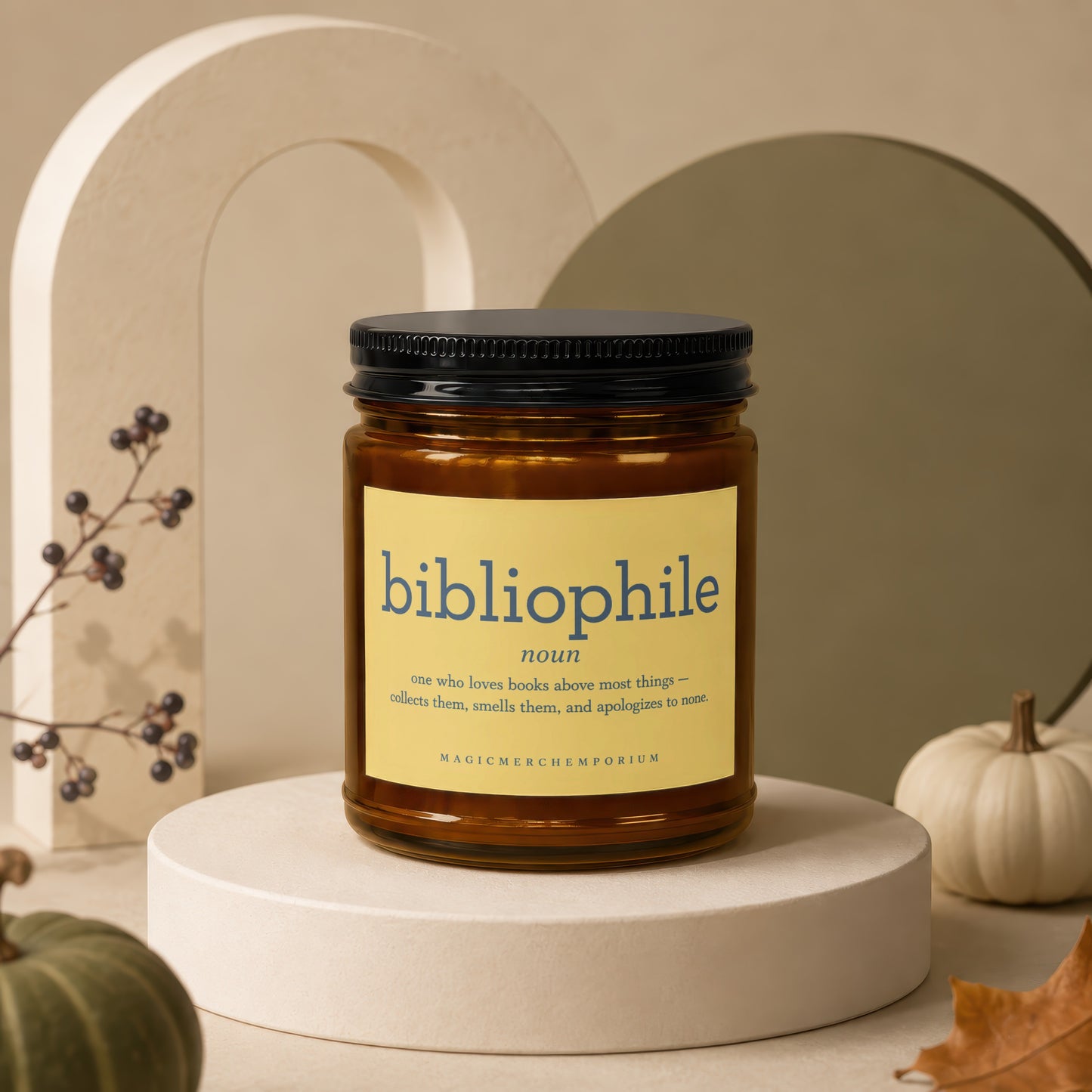 Amber jar candle with "bibliophile" definition and brand name.