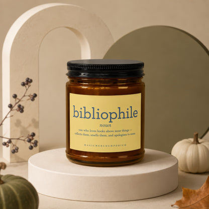 Amber jar candle with "bibliophile" definition and brand name.