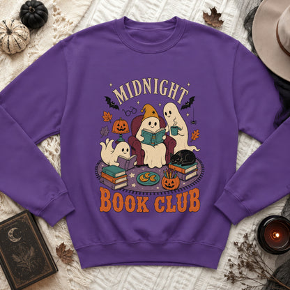 Purple sweatshirt with a "Midnight Book Club" Halloween graphic featuring ghosts reading and a black cat.