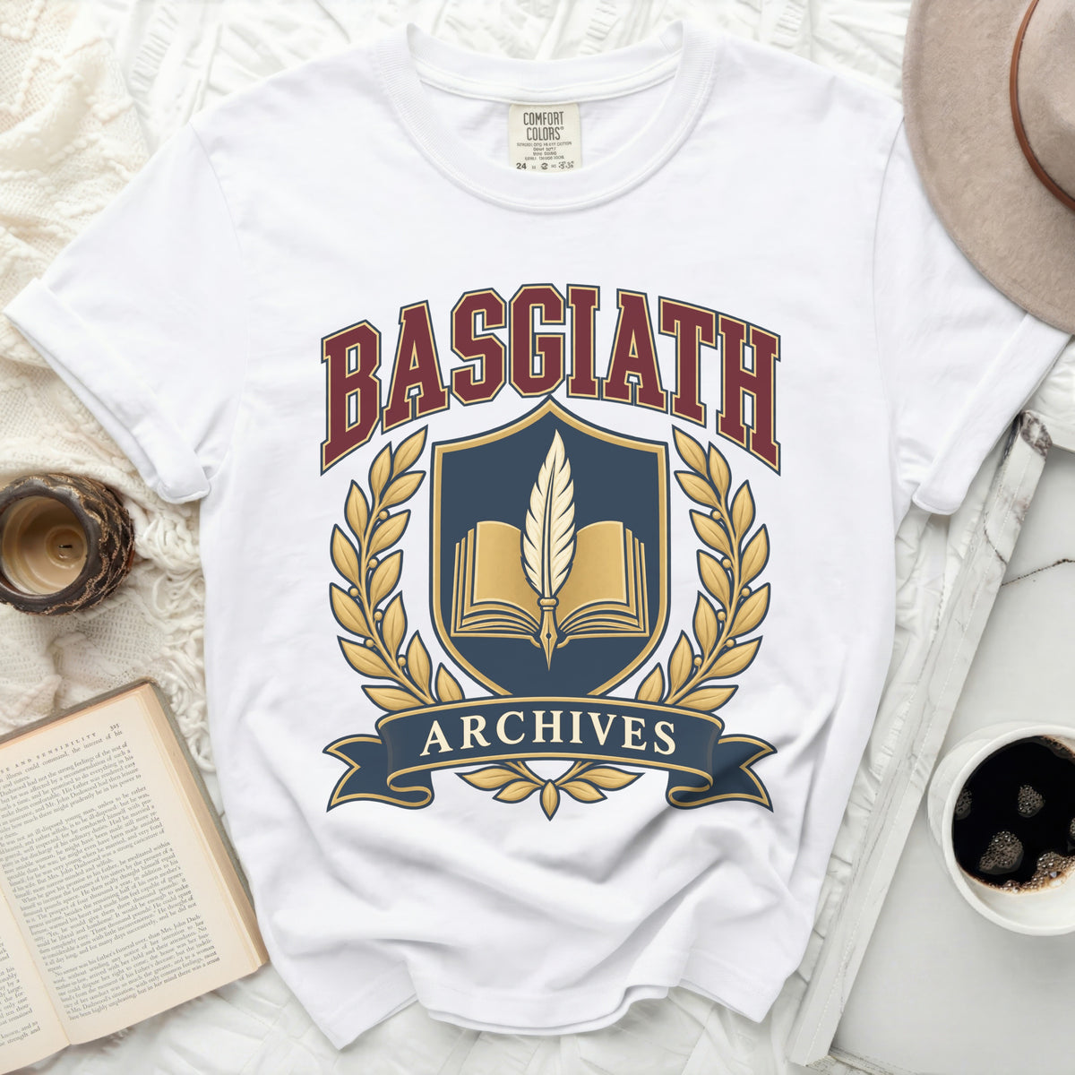 White t-shirt with Basgiath Archives crest featuring open book and quill.