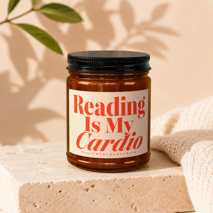 Amber glass candle with a white label that reads "Reading Is My Cardio MAGICMERCHEMPORIUM".