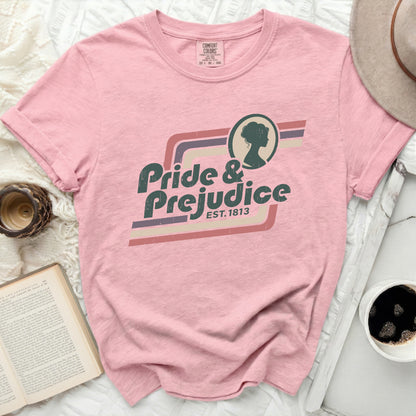 Pink t-shirt with "Pride & Prejudice Est. 1813" graphic and silhouette.