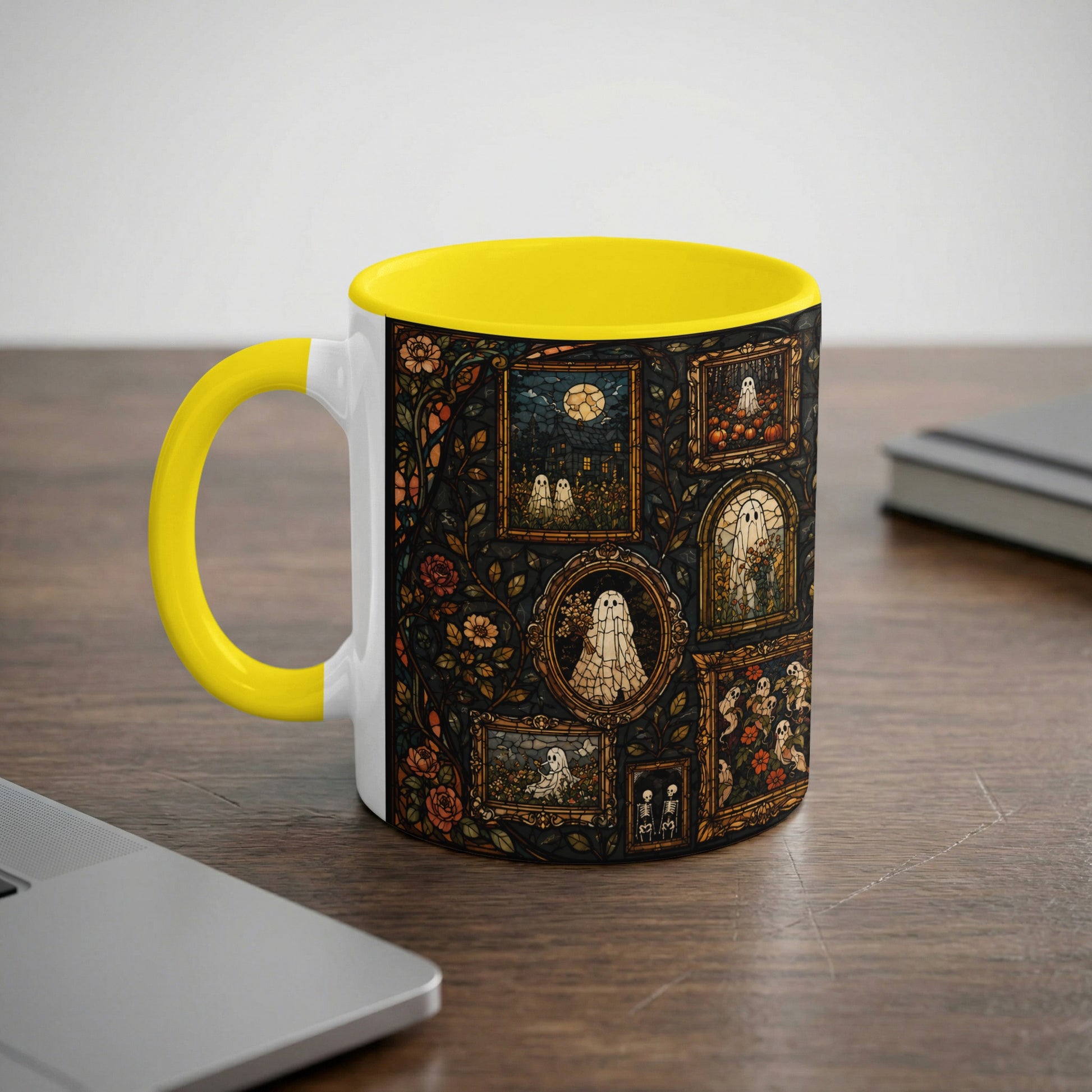 White mug with yellow handle featuring a stained-glass pattern of ghosts and flowers.