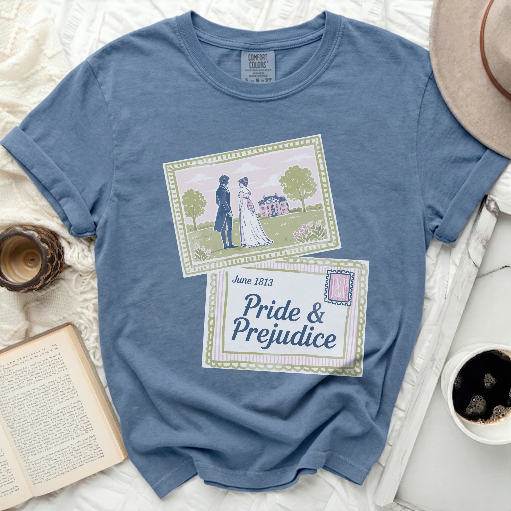 Blue t-shirt with "Pride & Prejudice" and a vintage illustration of a couple.