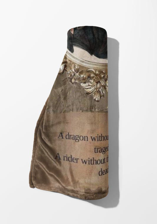 Brown blanket with text: "A dragon without a rider without the dead".