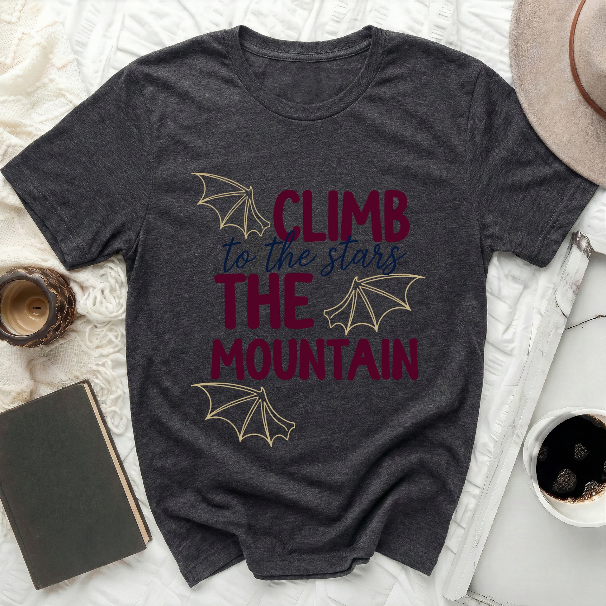 CLIMB to the stars THE MOUNTAIN design t-shirt product type
T-shirt
Graphic Tee
Mountain Print
Stars Design
Inspirational Shirt
Motivational Top
Adventure Apparel
Fantasy Wings
Bat Wings
Dark Gray Tee
Quote Shirt
Unique Graphic
Casual Wear
Nature Theme
Explore Life
Dream Chaser
Outdoors Enthusiast
Maroon Text
Gold Outline
Comfort Fit