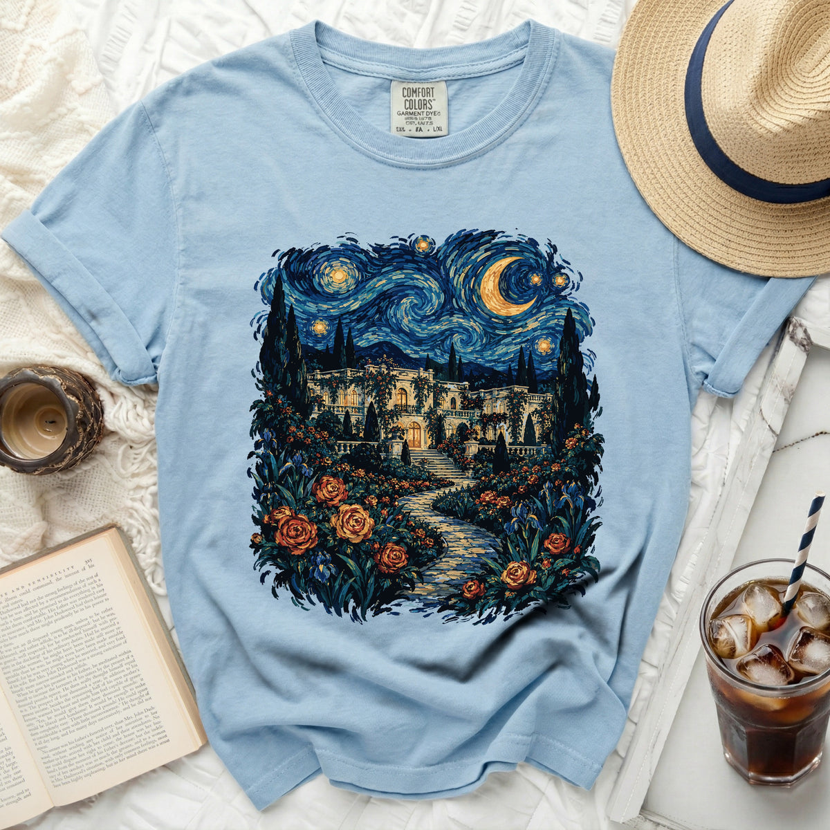 Light blue Comfort Colors t-shirt with starry night landscape print.
