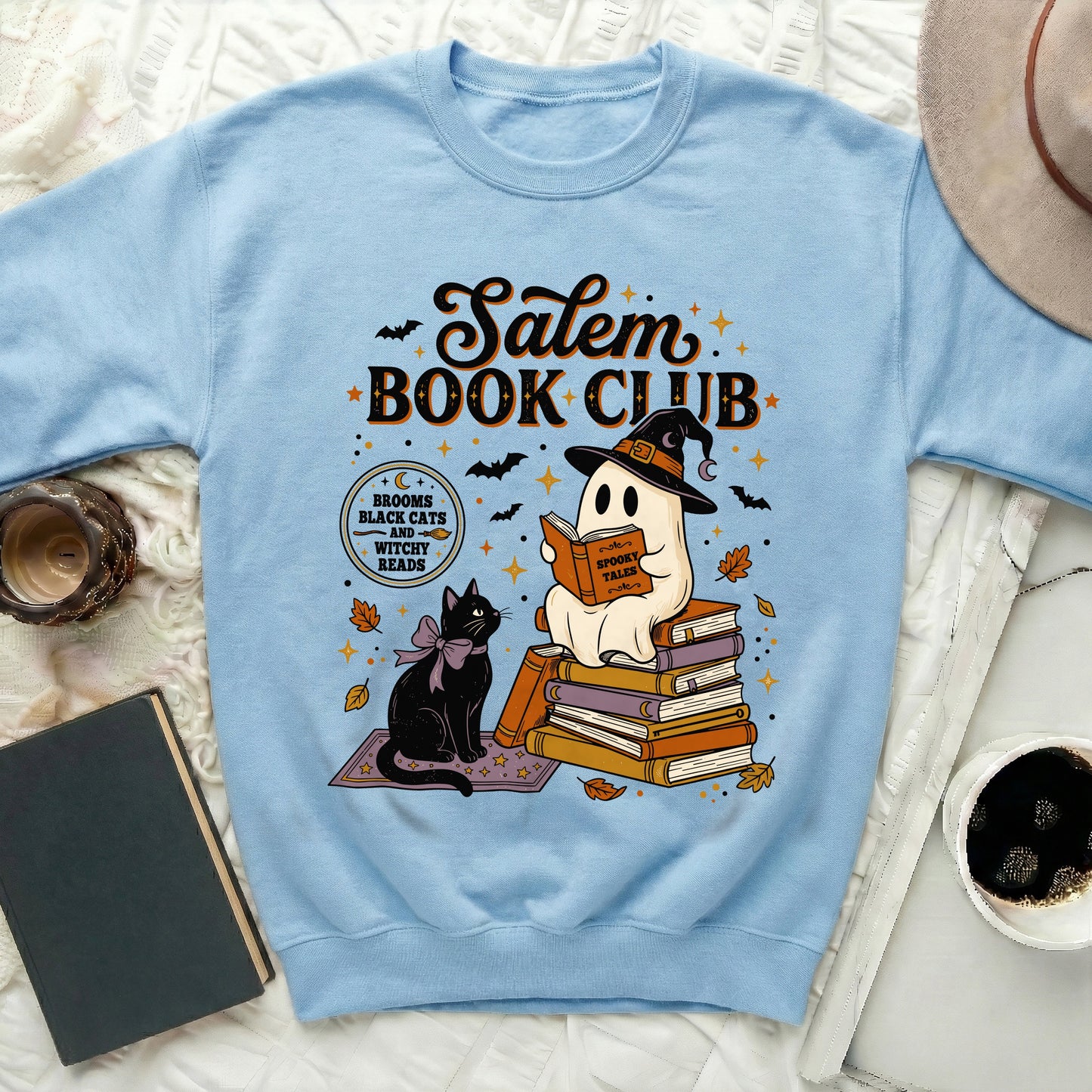 Light blue sweatshirt with Salem Book Club graphic featuring a ghost reading and a black cat.