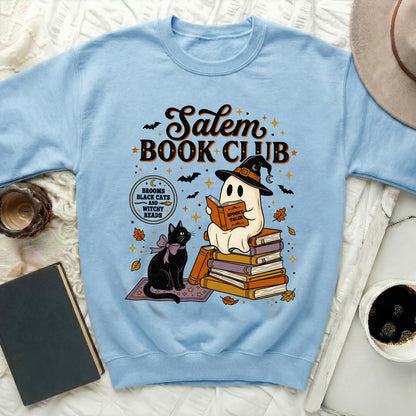 Light blue sweatshirt with Salem Book Club graphic featuring a ghost reading and a black cat.