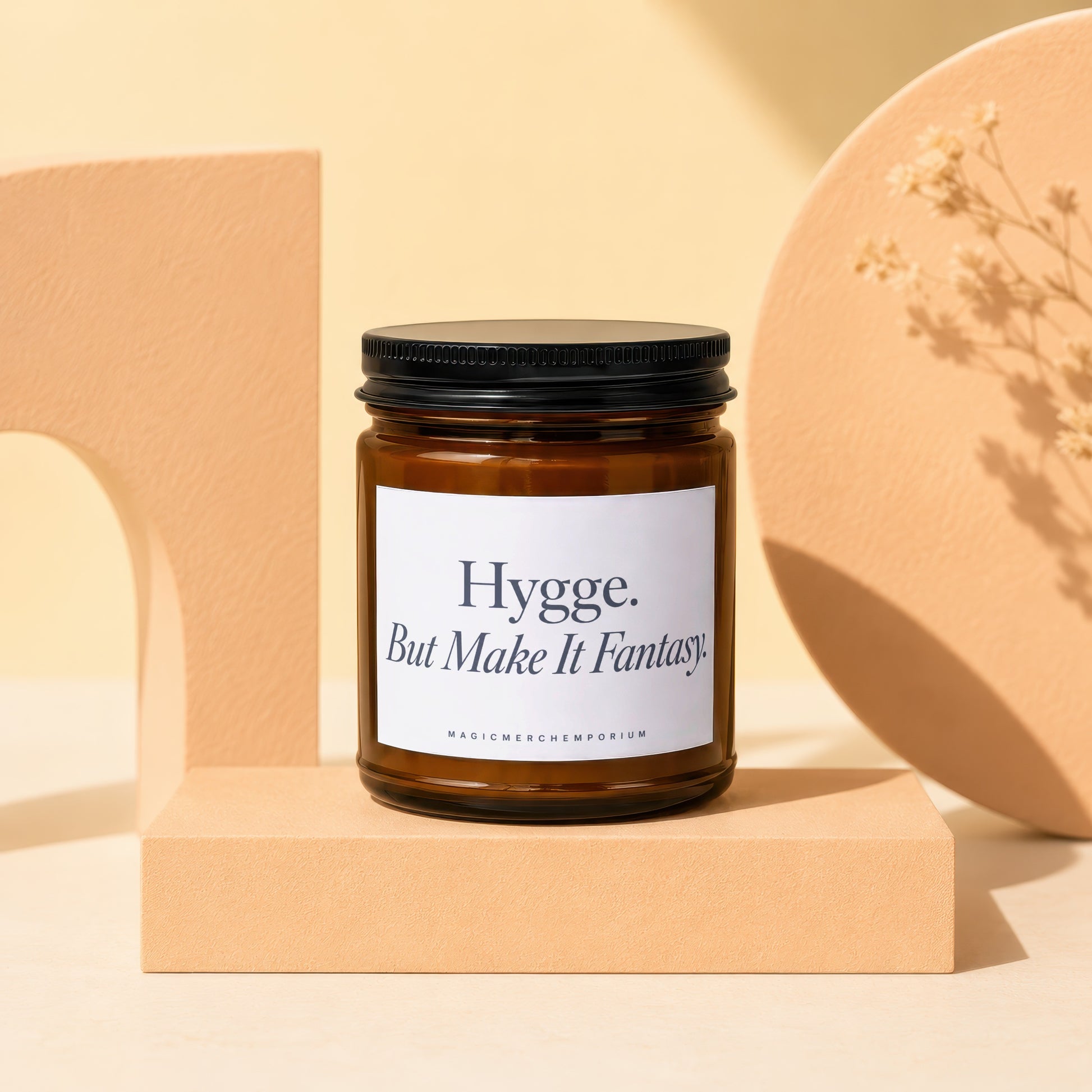 Amber jar candle with "Hygge. But Make It Fantasy." text by Magic Merch Emporium.