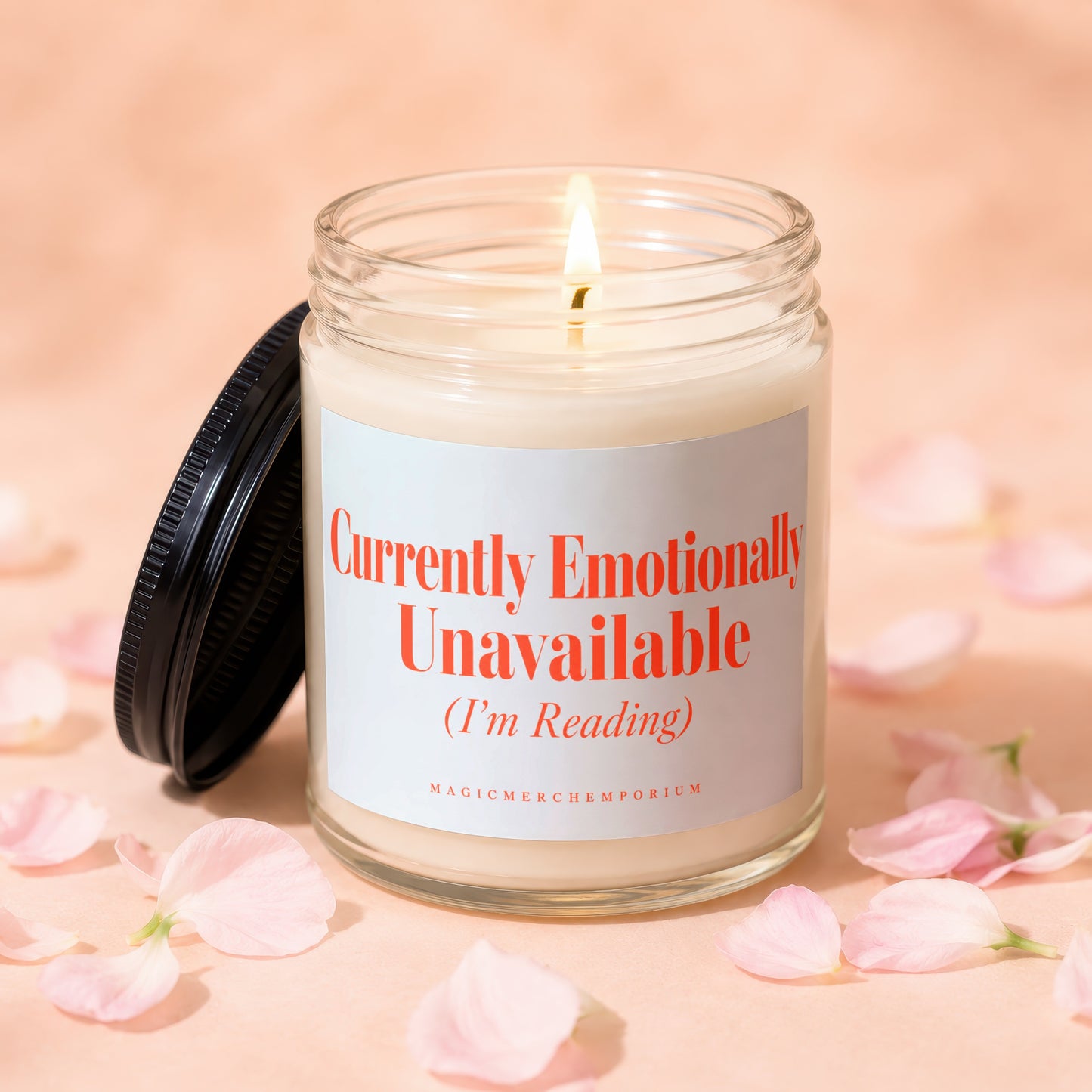 Glass candle burning with lid off, stating "Currently Emotionally Unavailable (I'm Reading)".