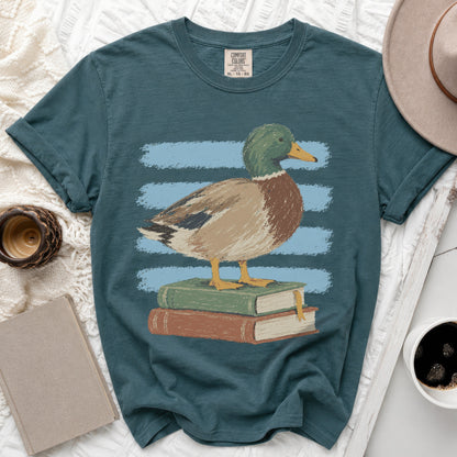 Mallard duck standing on stacked books with blue stripes behind it.