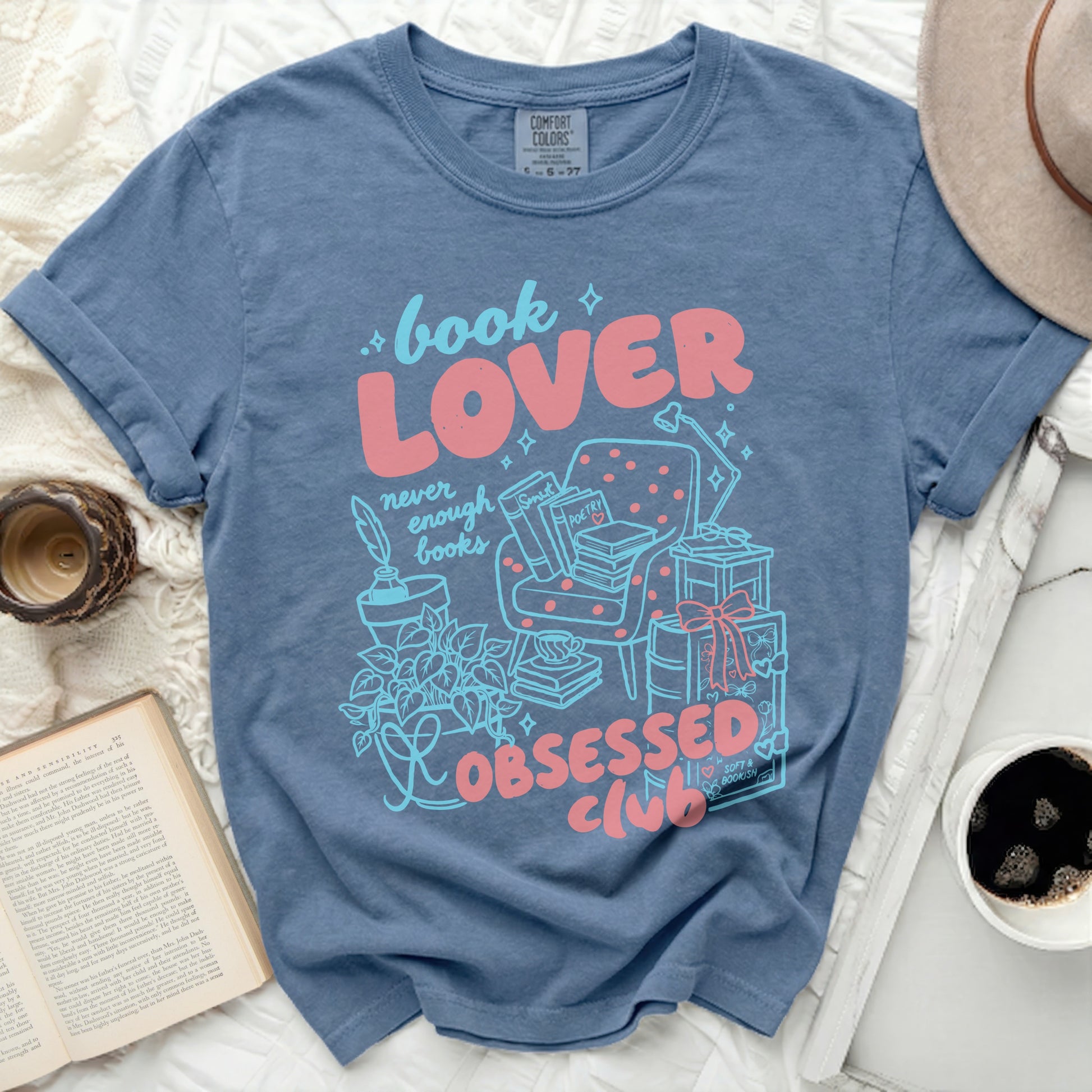 Blue t-shirt with "book LOVER never enough books OBSESSED CLUB" graphic.