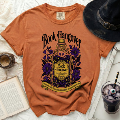 Orange t-shirt with "Book Hangover" and a potion bottle design.