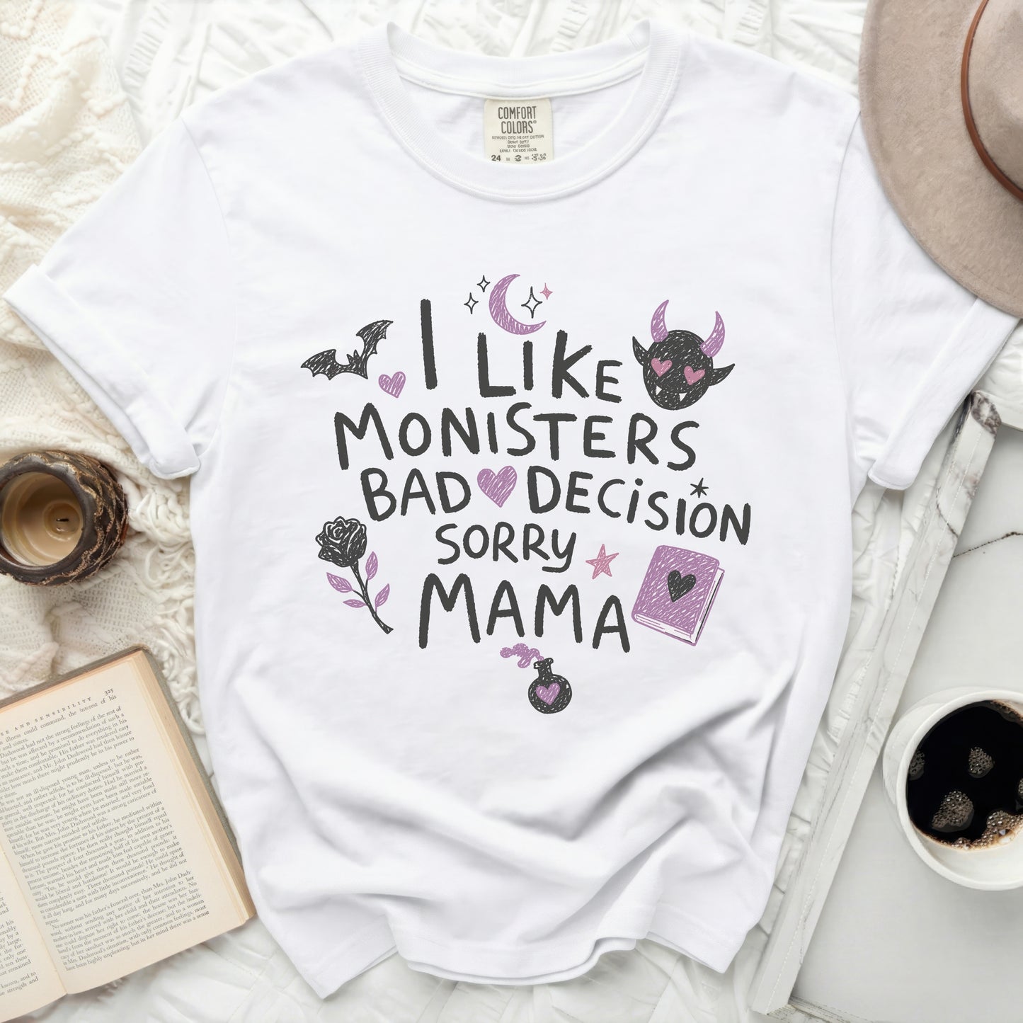 White t-shirt with "I like monsters bad decision sorry mama" graphic.