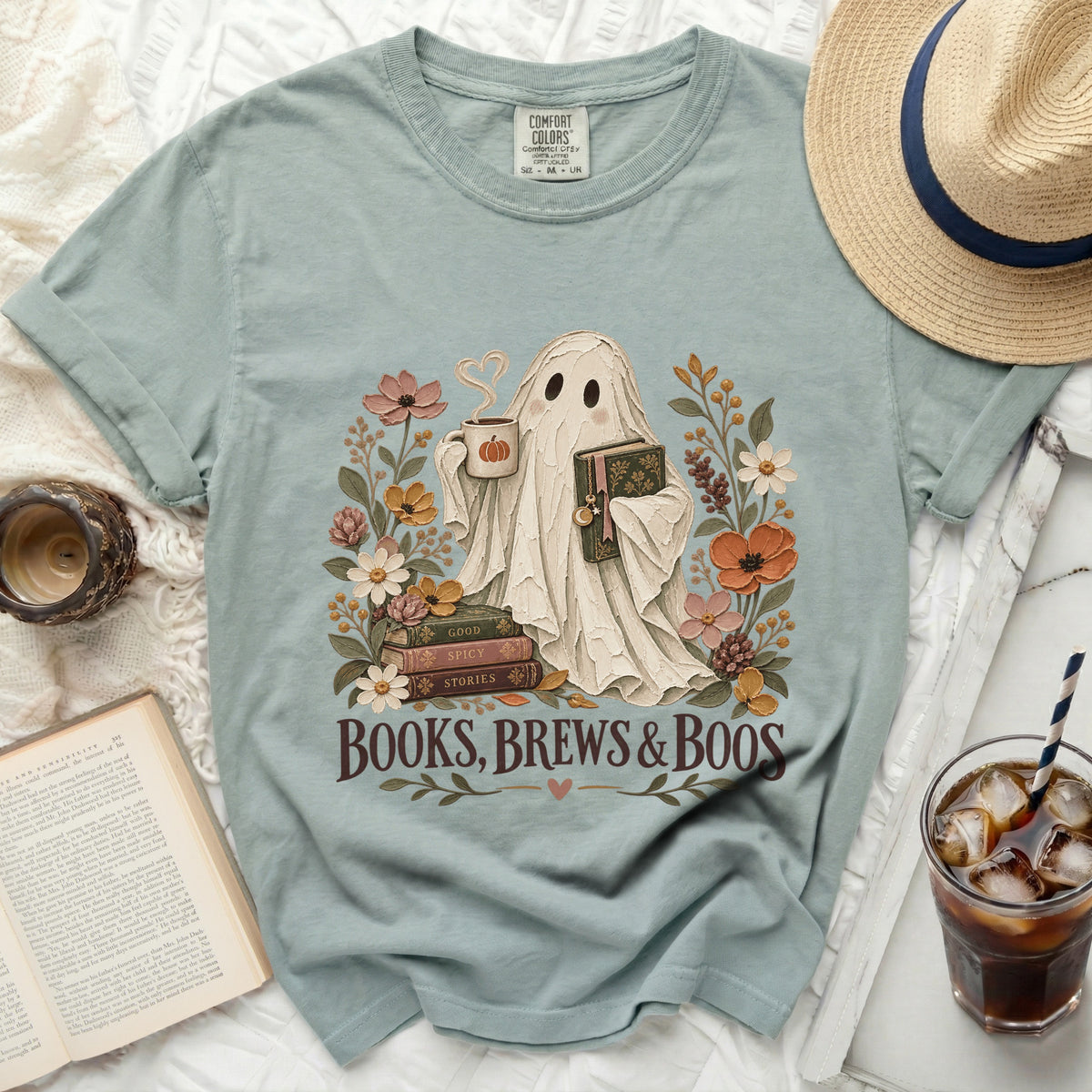 Ghost holding coffee and book surrounded by flowers, text "Books, Brews & Boos".