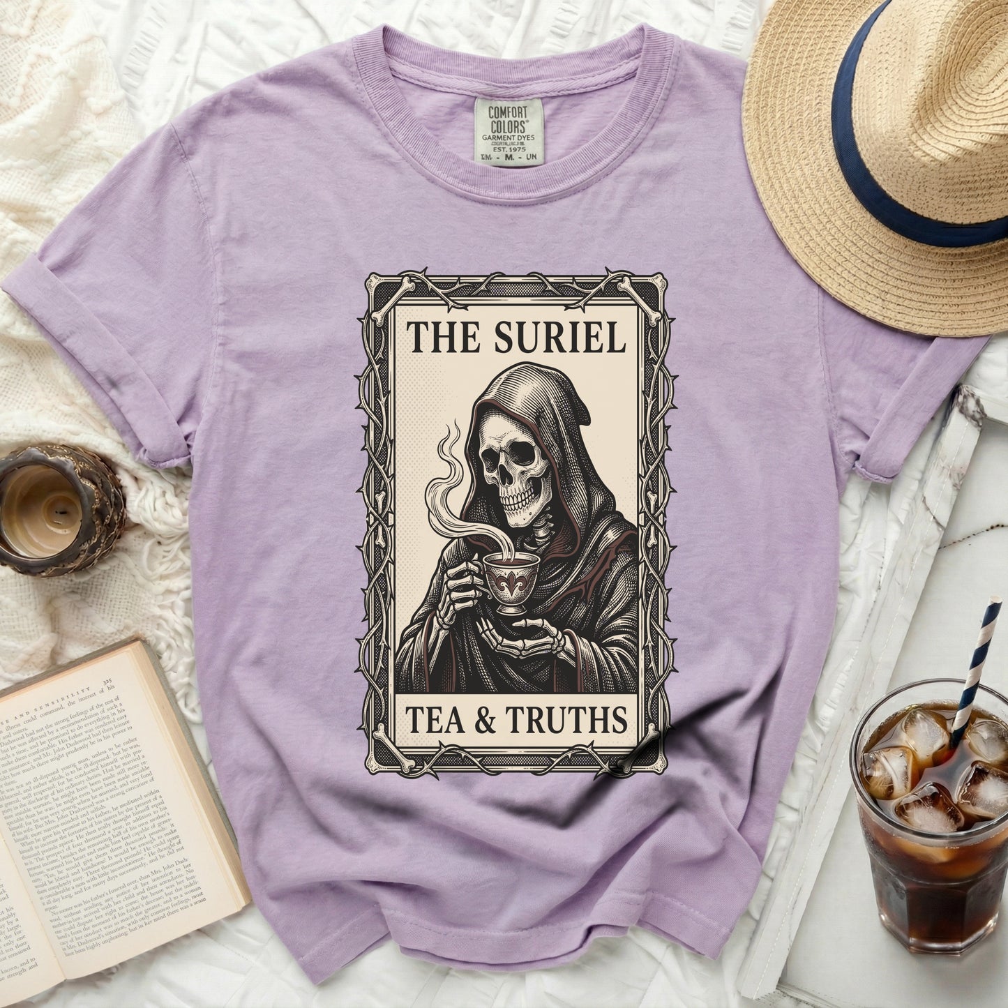 Purple Comfort Colors t-shirt featuring grim reaper drinking tea with text "THE SURIEL TEA & TRUTHS".