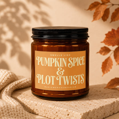 Amber candle with "Pumpkin Spice & Plot Twists" label.
