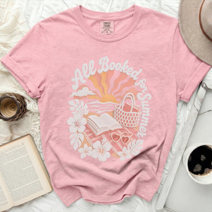 Pink t-shirt with "All Booked for Summer" and beach graphic.