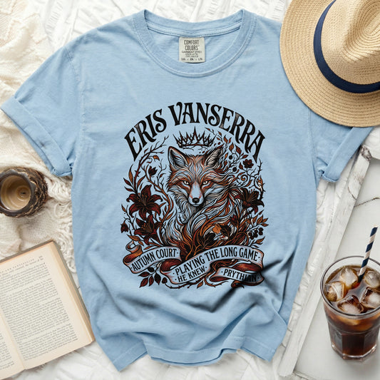 Light blue t-shirt with a graphic of a fox and floral elements, and text.