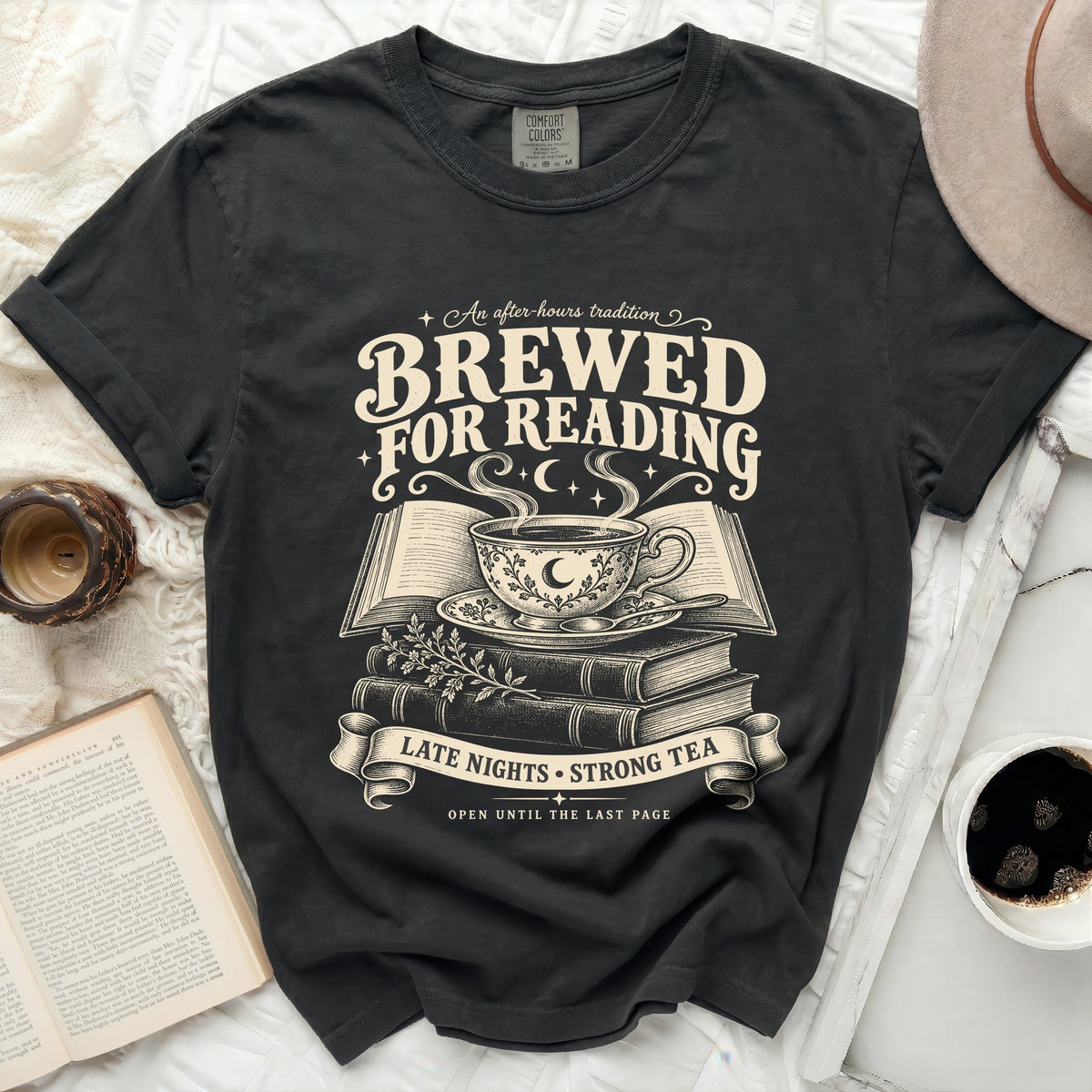 Dark t-shirt with "Brewed for Reading" text and book-tea illustration.
