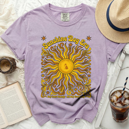 Purple t-shirt with "Sunshine Boy Era" text and sun graphic.