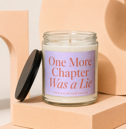 Glass candle with a lilac label that reads "One More Chapter Was a Lie".
