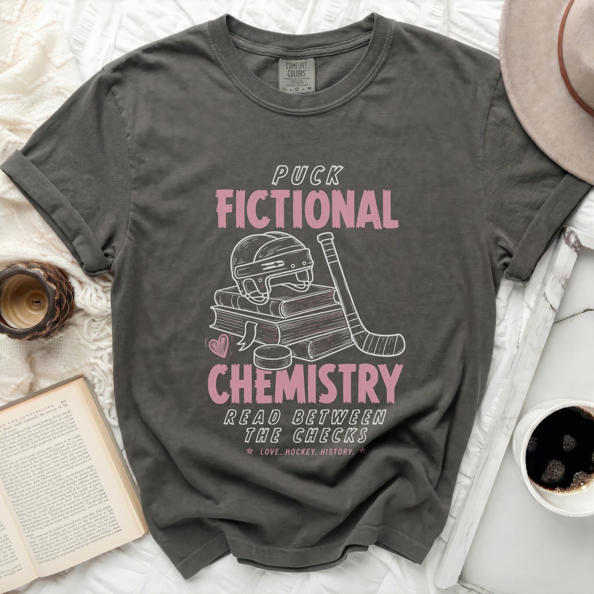 Dark gray t-shirt with hockey graphics and "Puck Chemistry" text.