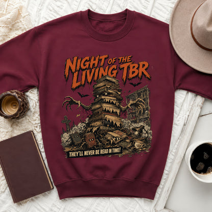 Maroon sweatshirt with "Night of the Living TBR" and a stack of creepy books.