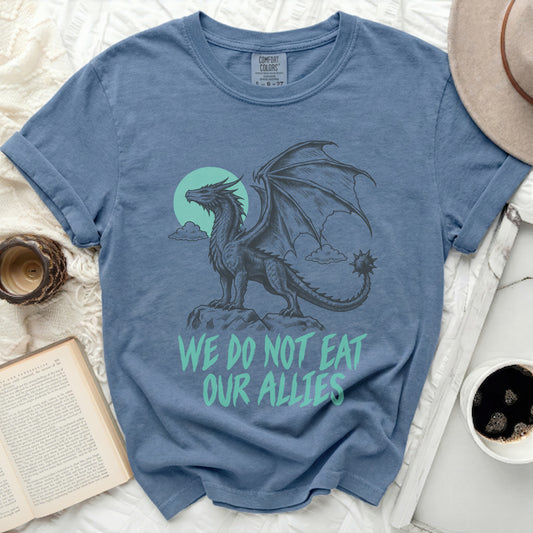 Blue t-shirt with a black dragon graphic and the text "WE DO NOT EAT OUR ALLIES".
