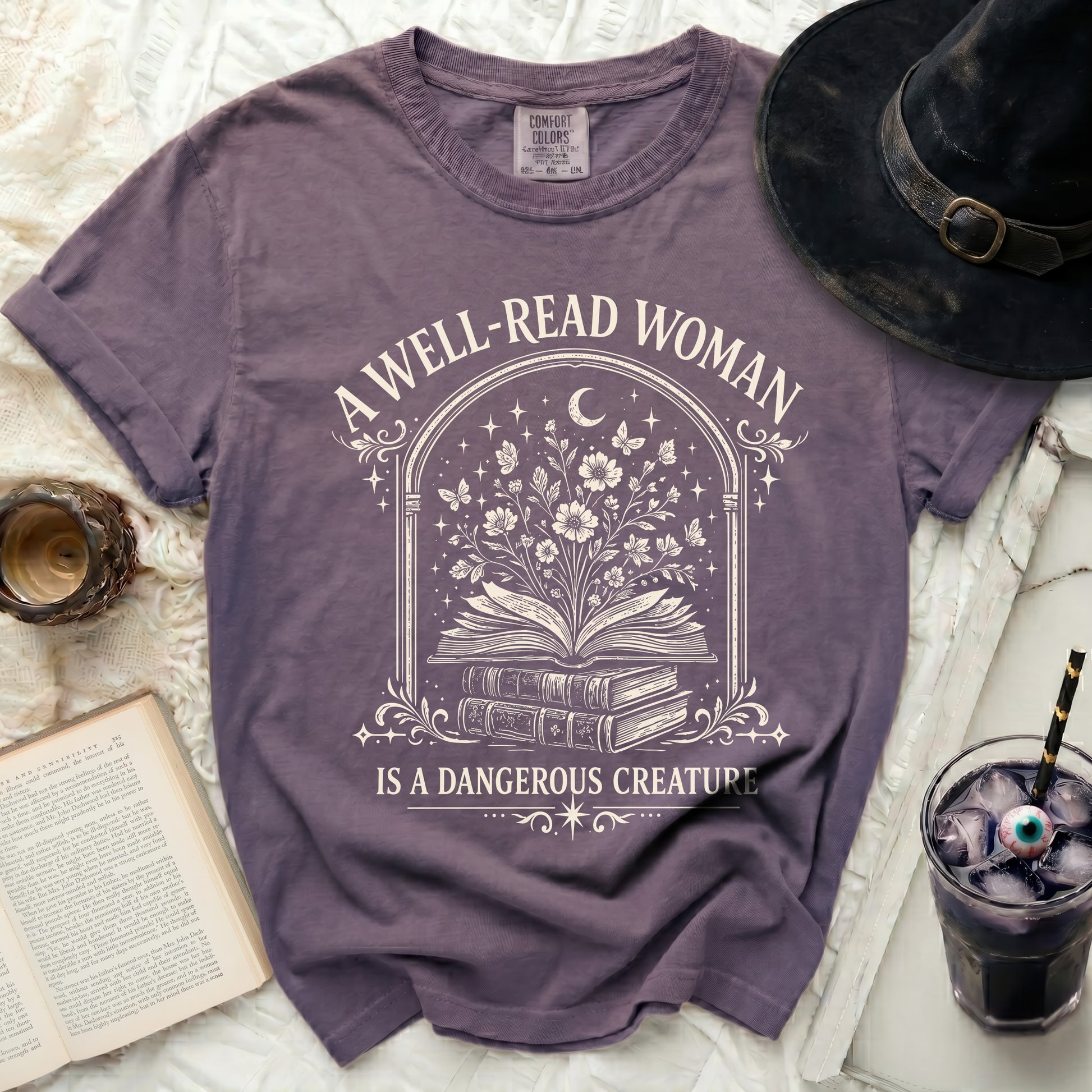 Purple t-shirt with "A Well-Read Woman Is A Dangerous Creature" graphic.
