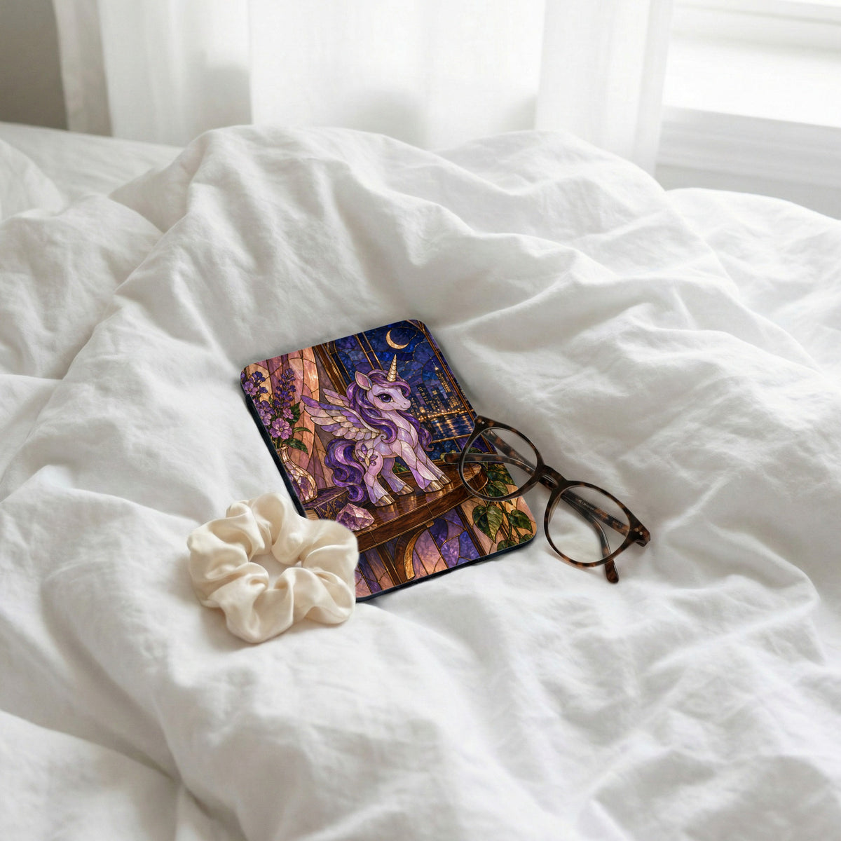 Stained glass style unicorn on a coaster with a cityscape and moon.