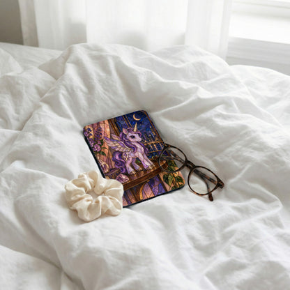 Stained glass style unicorn on a coaster with a cityscape and moon.