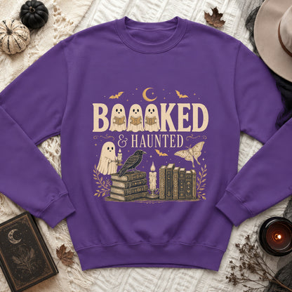 Purple sweatshirt with "Booooked & Haunted" text and Halloween-themed illustrations.