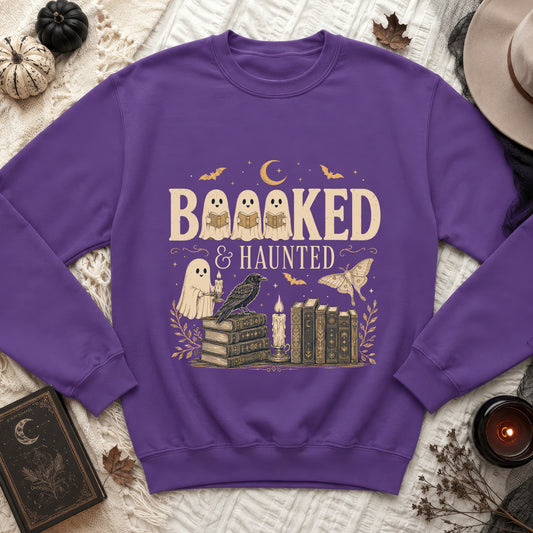 Purple sweatshirt with "Booooked & Haunted" text and Halloween-themed illustrations.