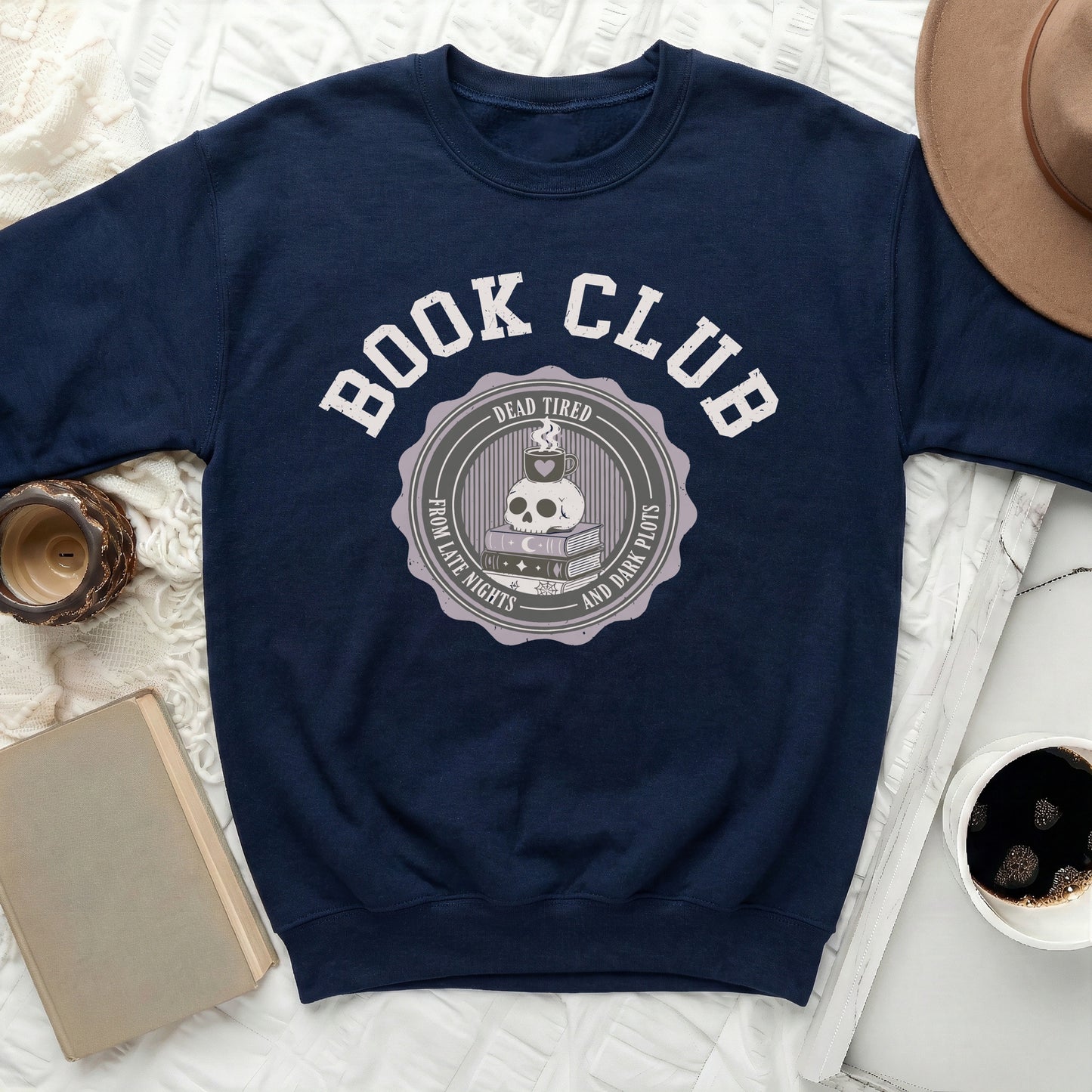 Navy sweatshirt with "Book Club" and skull graphic with coffee and books.