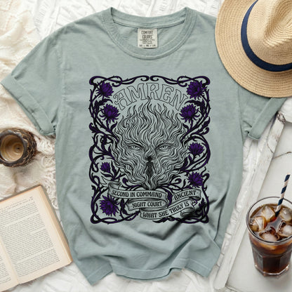 Green t-shirt with a black and purple "AMREN" design featuring a wolf head and floral motifs.