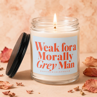 Candle with lit wick and label "Weak for a Morally Grey Man"