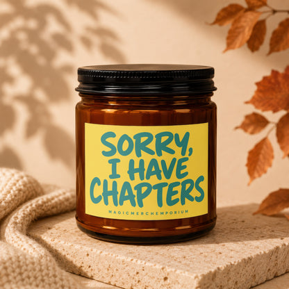 Amber jar candle with yellow label saying "SORRY, I HAVE CHAPTERS".
