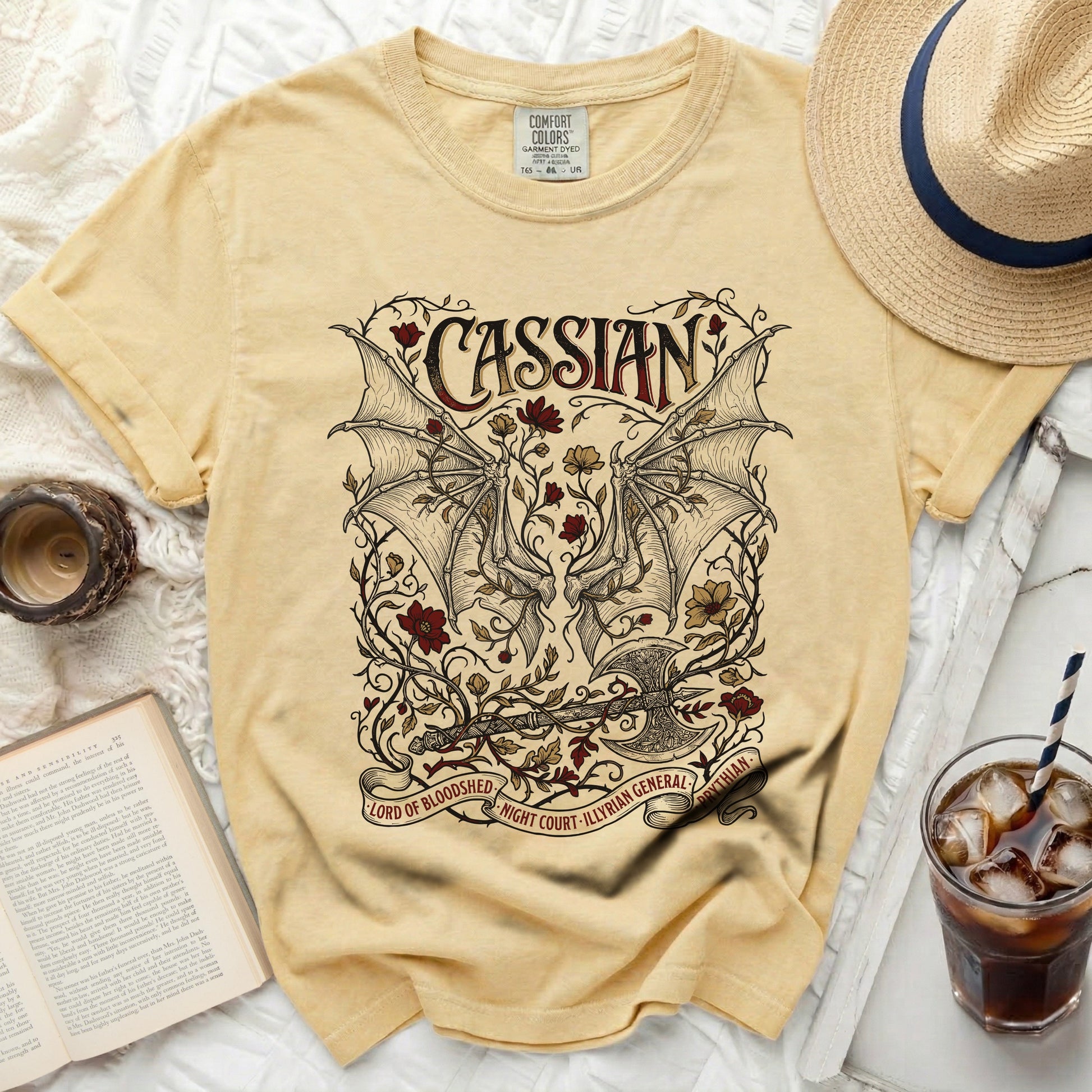 Yellow t-shirt with "Cassian Lord of Bloodshed" graphic and winged motif.