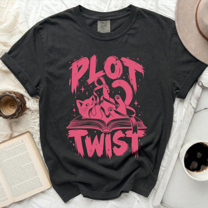 Black t-shirt with pink "PLOT TWIST" graphic featuring a cat and a book.
