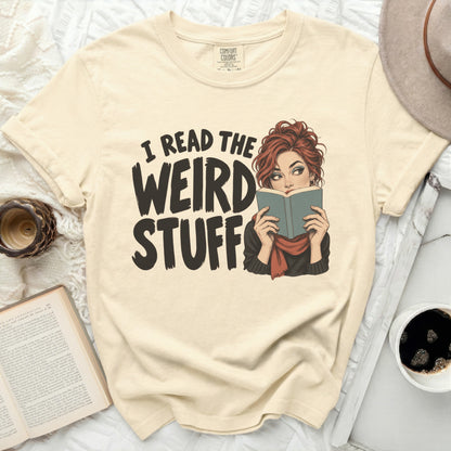 Cream t-shirt with "I READ THE WEIRD STUFF" graphic and woman reading