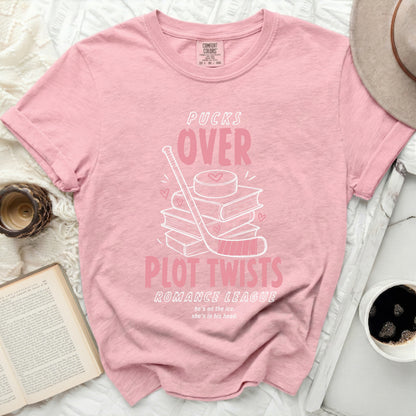 Pink t-shirt with "Pucks Over Plot Twists Romance League" and hockey graphic.
