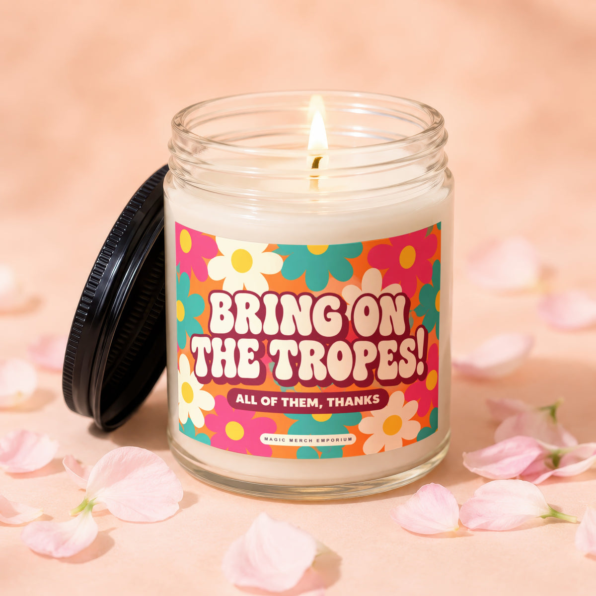 Candle with retro floral label reading "Bring on the Tropes! All of them, thanks".