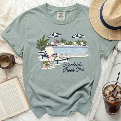 Blue t-shirt with "Poolside Book Club" text and pool scene graphic.